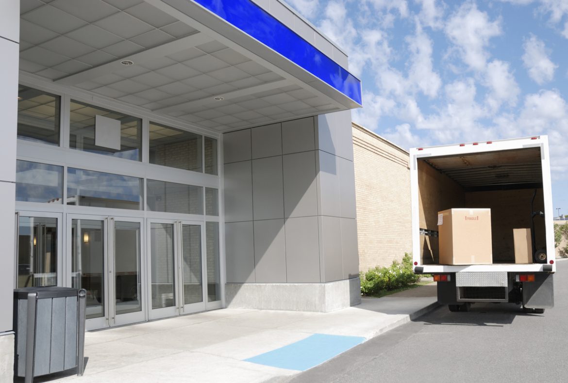 Moving truck at building door